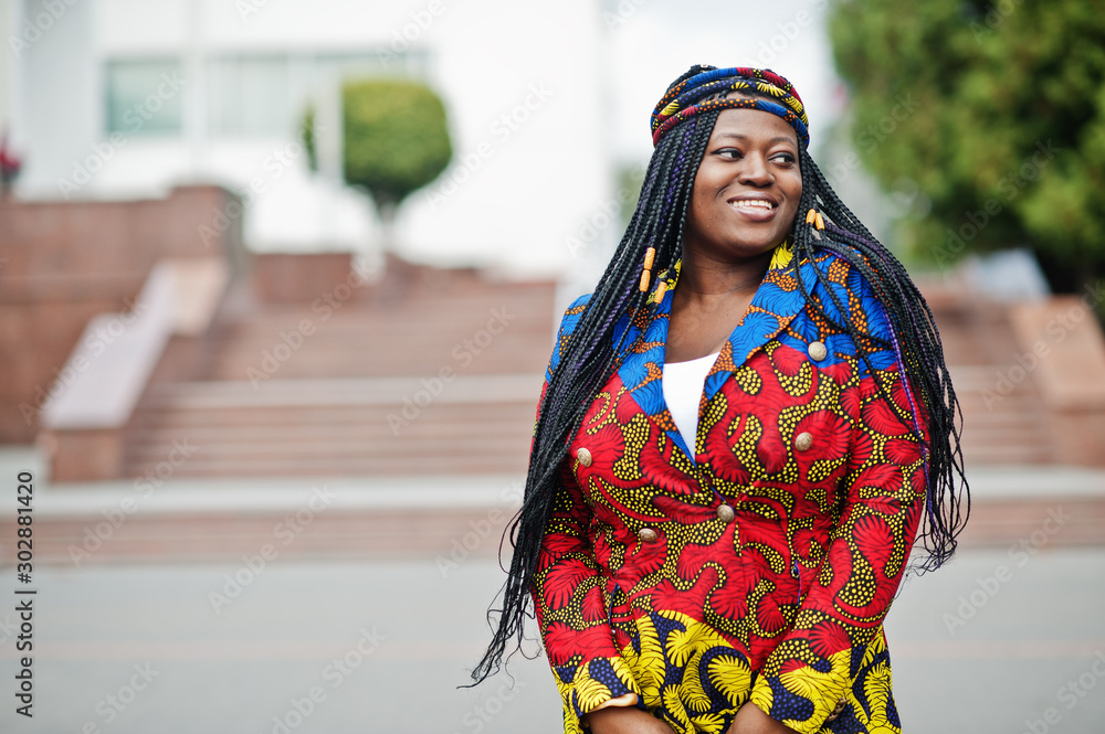Young black female posed in the city. African women single portrait.