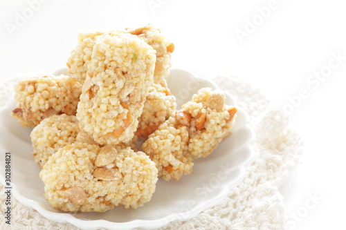 Asian confectionery, rice cracker on dish with copy space