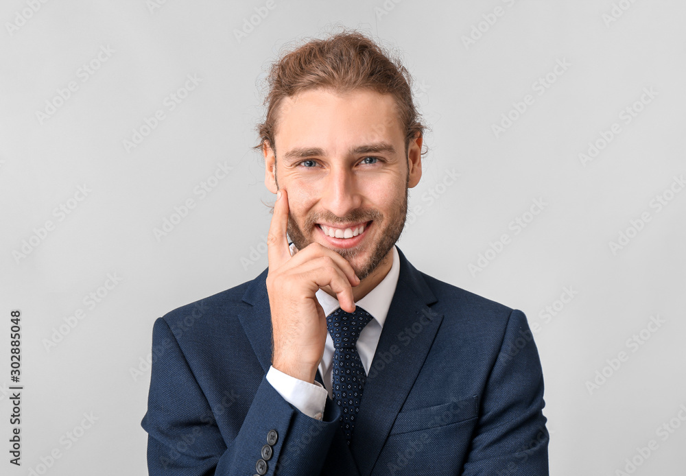 Portrait of businessman on grey background Portrait of businessman on grey background
