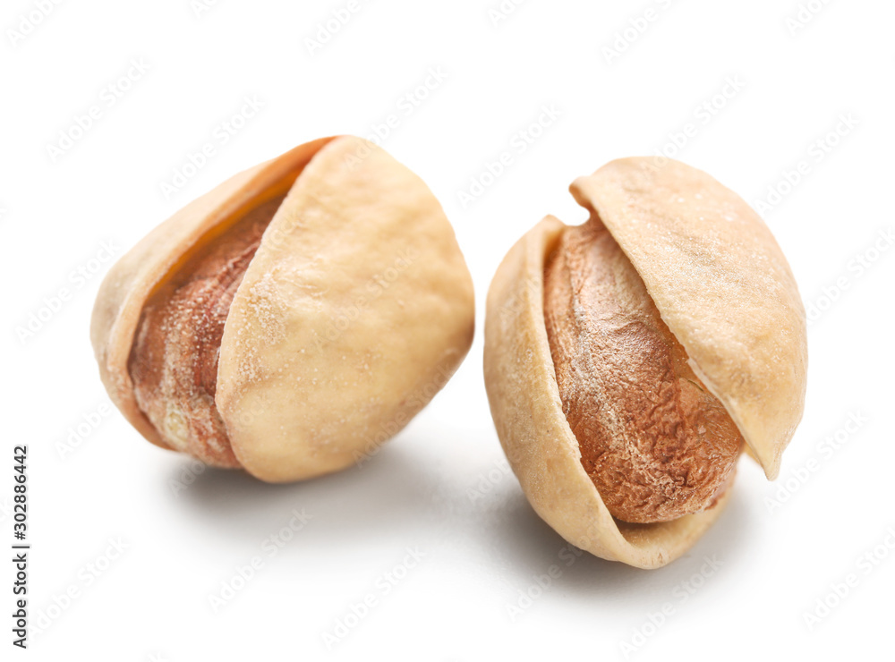 Tasty pistachio nuts isolated on white Tasty pistachio nuts isolated on white