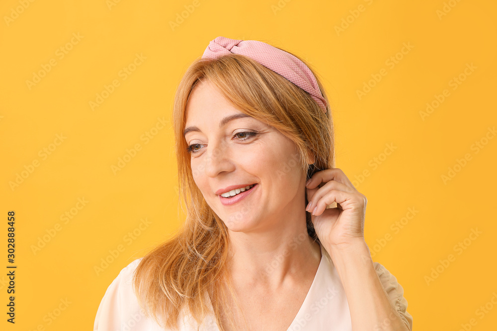 Stylish mature woman on color background Stylish mature woman on color background