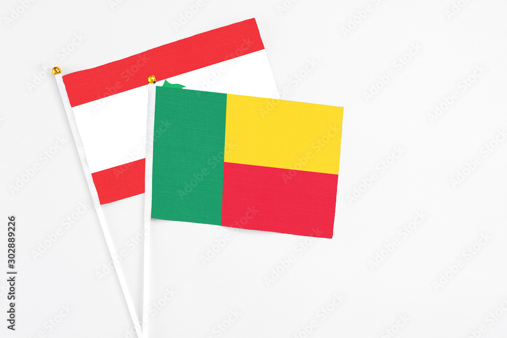 Benin and Lebanon stick flags on white background. High quality fabric, miniature national flag. Peaceful global concept.White floor for copy space. Benin and Lebanon stick flags on white background. High quality fabric, miniature national flag. Peaceful global concept.White floor for copy space.