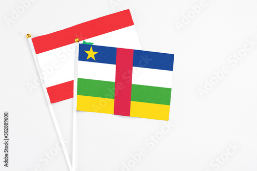 Central African Republic and Lebanon stick flags on white background. High quality fabric, miniature national flag. Peaceful global concept.White floor for copy space.