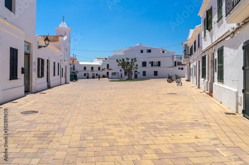 View of Traditional Spanish street in city of island Menorca photo
