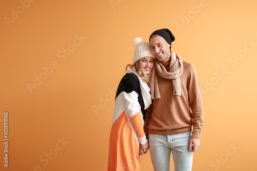 Happy young couple in warm ...