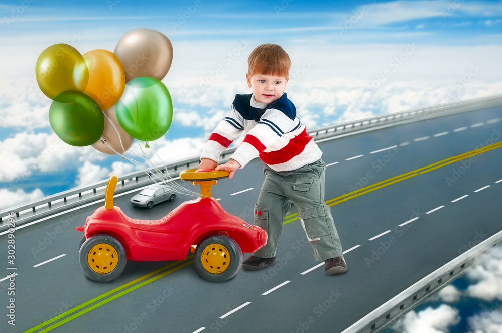 A boy is played with toy cars on a fabulous bridge that hovers in the clouds.