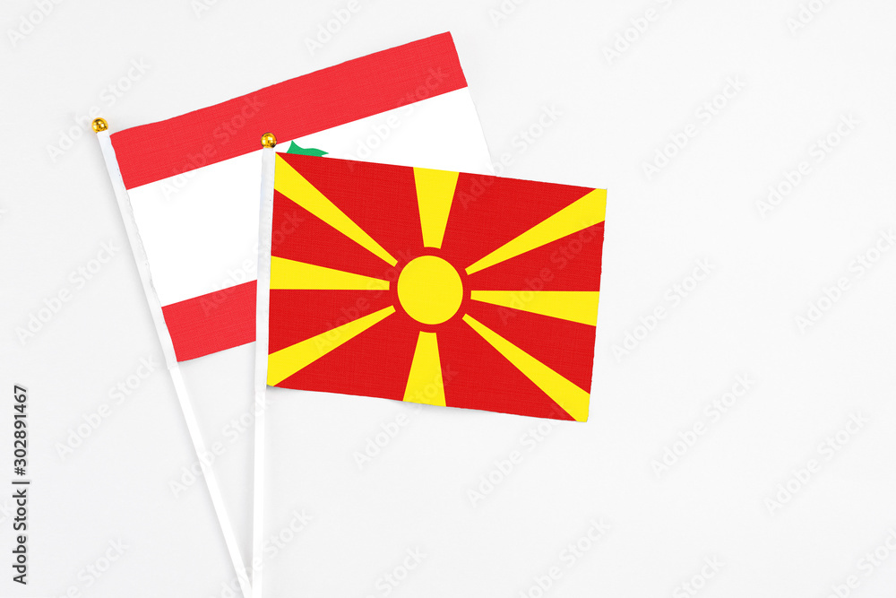 Macedonia and Lebanon stick flags on white background. High quality fabric, miniature national flag. Peaceful global concept.White floor for copy space.