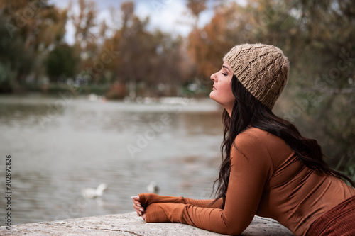Quadro em tela sad woman looking towards a lake
