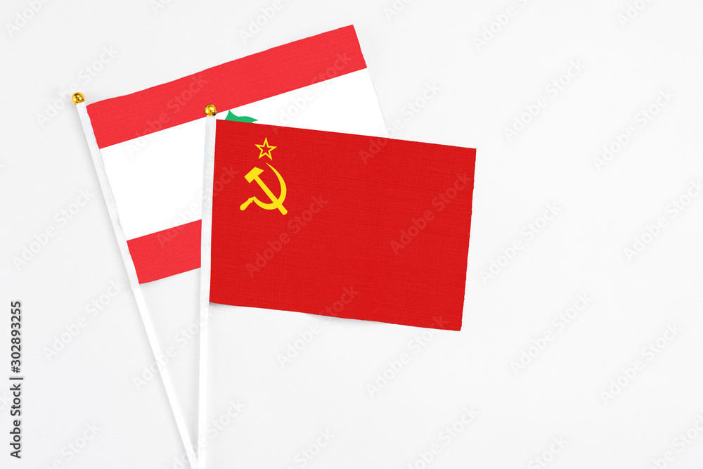 Soviet Union and Lebanon stick flags on white background. High quality fabric, miniature national flag. Peaceful global concept.White floor for copy space.