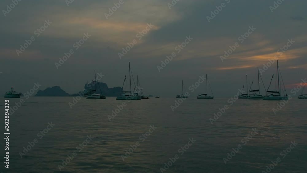 Moving around yachts near Railay Beach, Krabi, Thailand Moving around yachts near Railay Beach, Krabi, Thailand