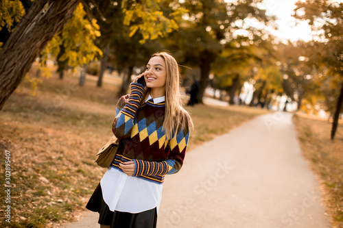 Pretty young woman walking ...