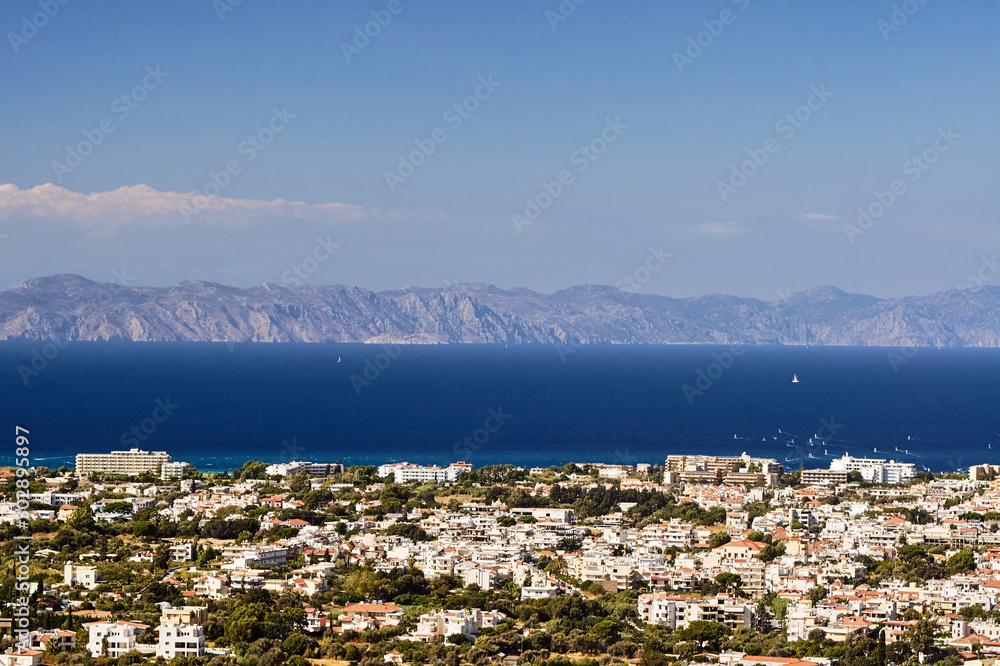 Town and sailboats off the coast of the Greek island of Rhodes.