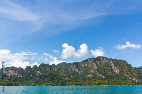 Landscape of mountains with cloud,blue sky and Lake. ratchaprapa dam. suratthani, Thailand photo