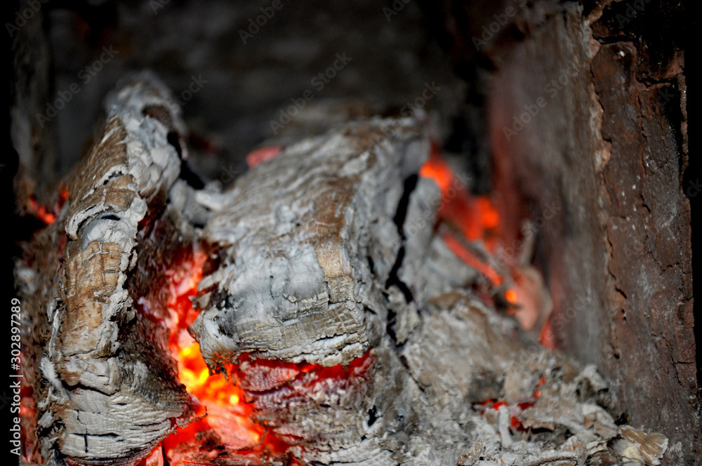 Glowing red embers. burning logs. heating firewood in oven