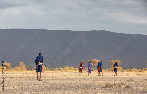 maasai warriors in a savannah