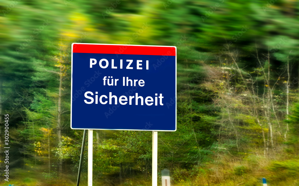 Austrian police sign near the road. Polizei für ihre Sicherheit (engl. police for your safety)