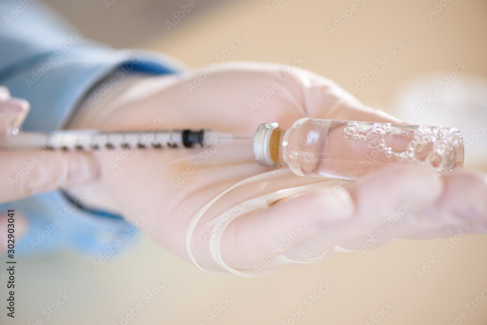 Docto fills a syringe for insulin injections. Diabetes. The shortacting insulin. Insulin injection Docto fills a syringe for insulin injections. Diabetes. The shortacting insulin. Insulin injection