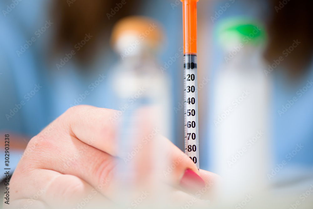 Fototapeta premium Spitz with insulin in the hands of the patient. Diabetes.