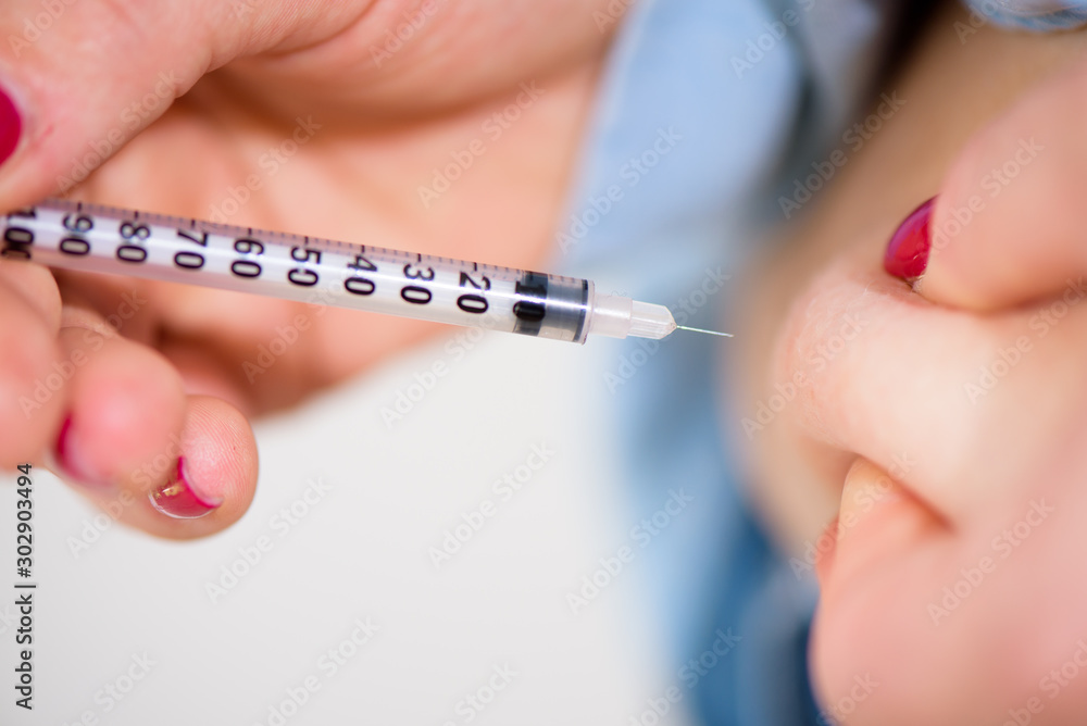 Diabetes patient insulin shot by syringe with dose of lantus, su Diabetes patient insulin shot by syringe with dose of lantus, su