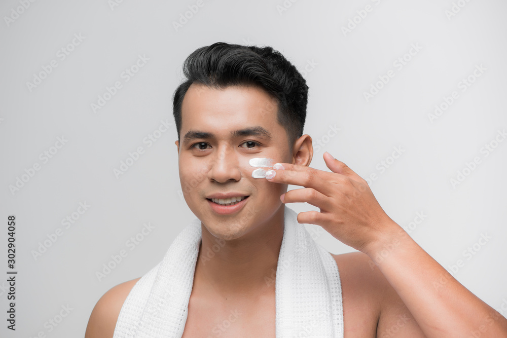 Handsome man applying - anti-aging concept Handsome man applying - anti-aging concept