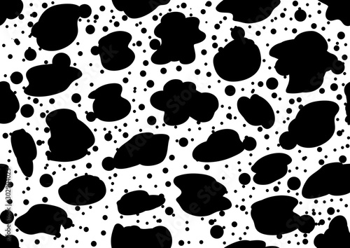 cow patches - repeated seamless pattern black and white spots on the fabric.