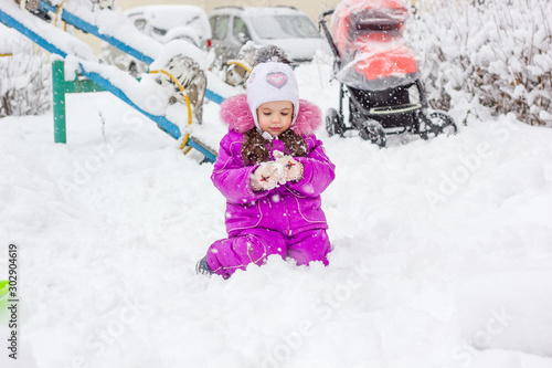 Little kid girl playing in ...