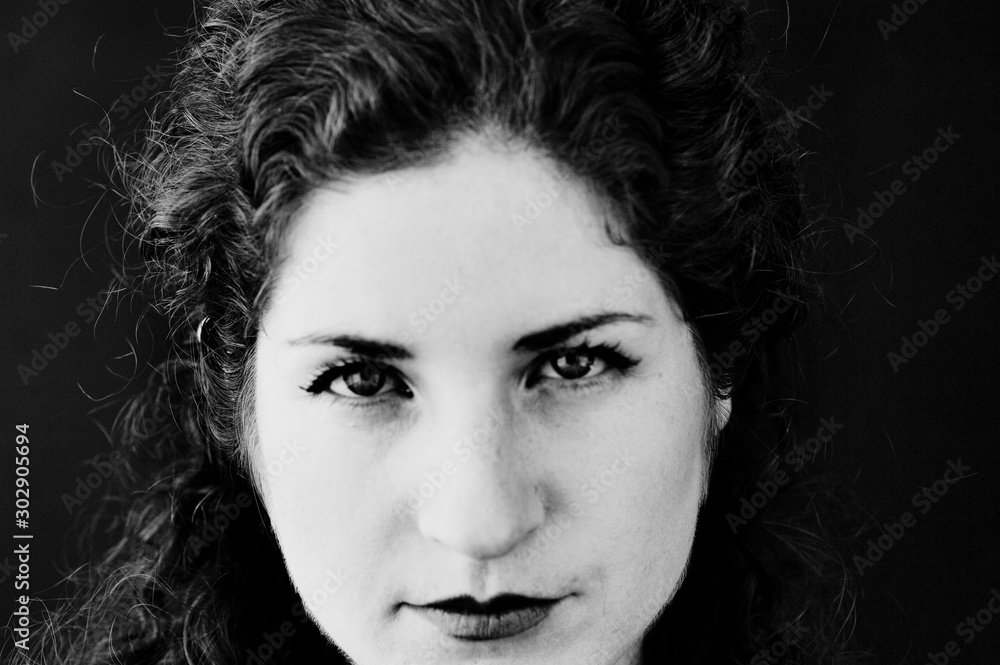 Serious Woman photographed with her face close-up. Serious Woman photographed with her face close-up.