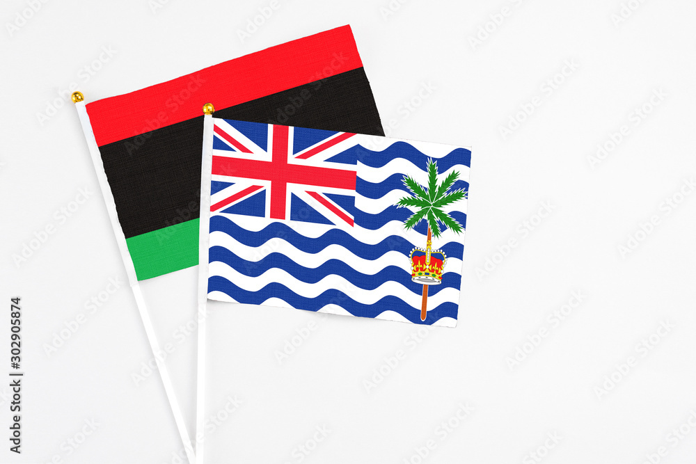 British Indian Ocean Territory and Libya stick flags on white background. High quality fabric, miniature national flag. Peaceful global concept.White floor for copy space. British Indian Ocean Territory and Libya stick flags on white background. High quality fabric, miniature national flag. Peaceful global concept.White floor for copy space.