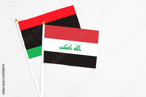 Free Download Iraq and Libya stick flags on white background. High quality fabric, miniature national flag. Peaceful global concept.White floor for copy space. - GFXLoad
