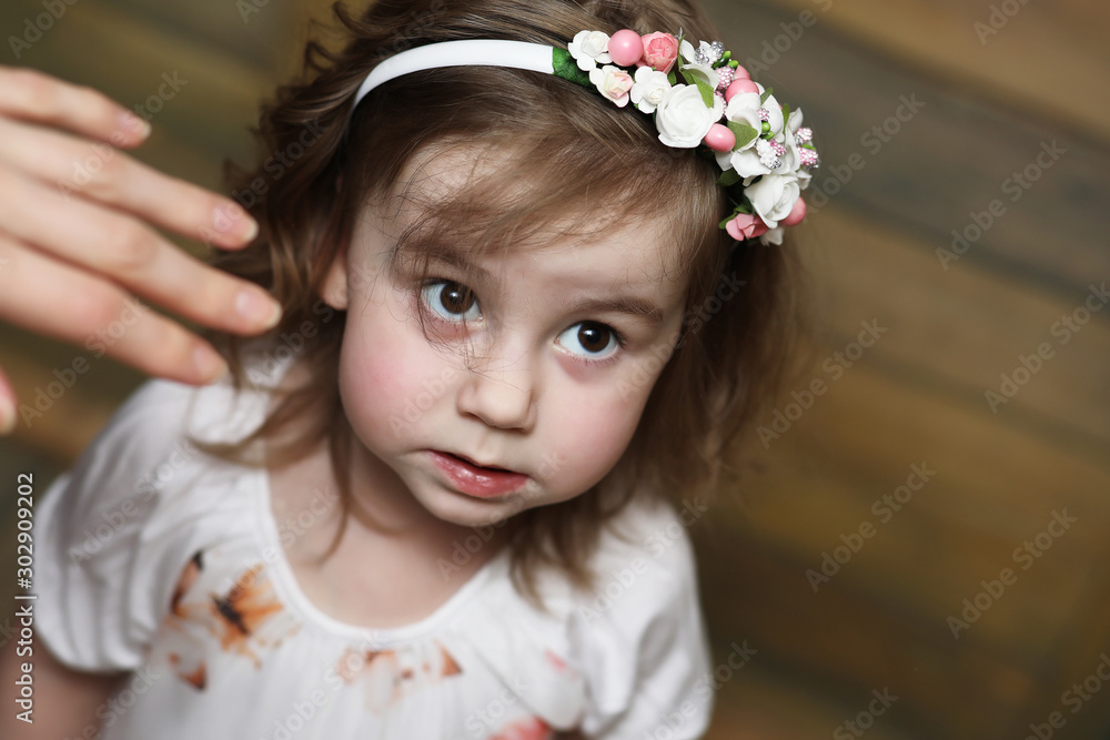 Little girl with curly hair, having fun while posing Little girl with curly hair, having fun while posing