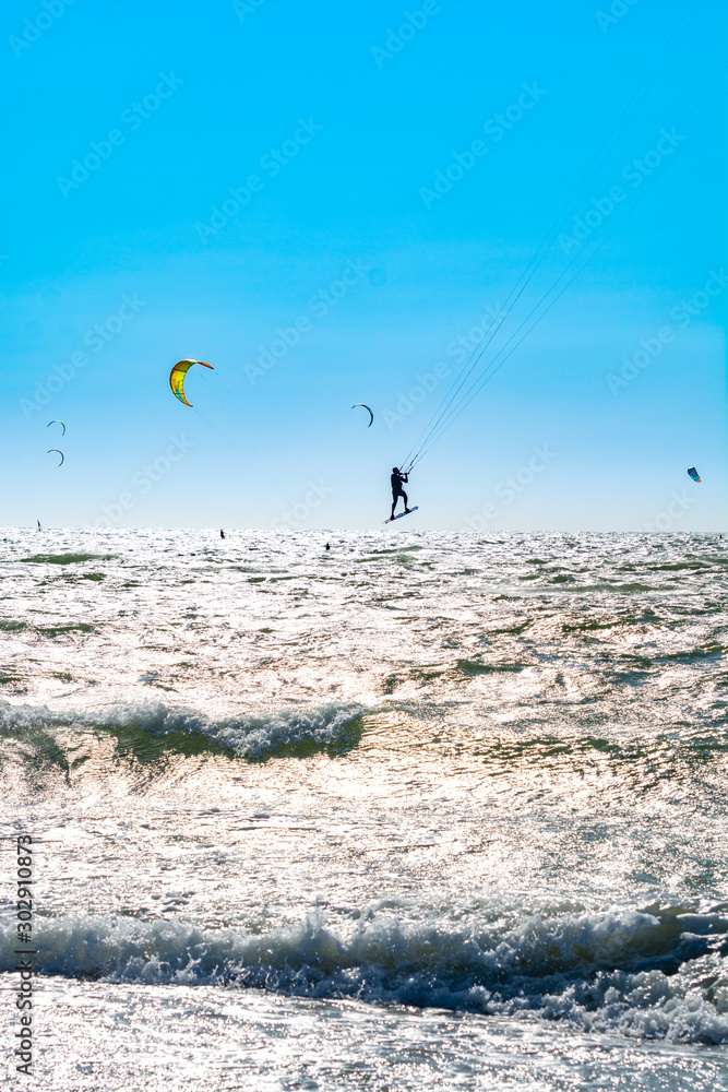 Water sport event, kite surfers race in North Sea near Renesse, Zeeland, Netherlands