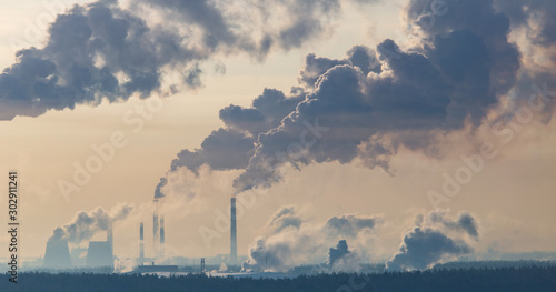 Smoke from the chimneys of a metallurgical plant at dawn