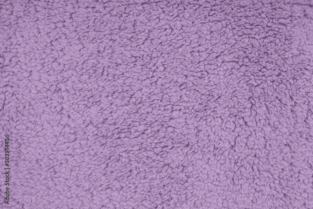 Purple sherpa textured plush fabric material background Purple sherpa textured plush fabric material background