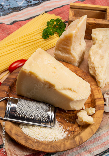 Cooking with hard italian cheese, grated parmesan or grana padano cheese