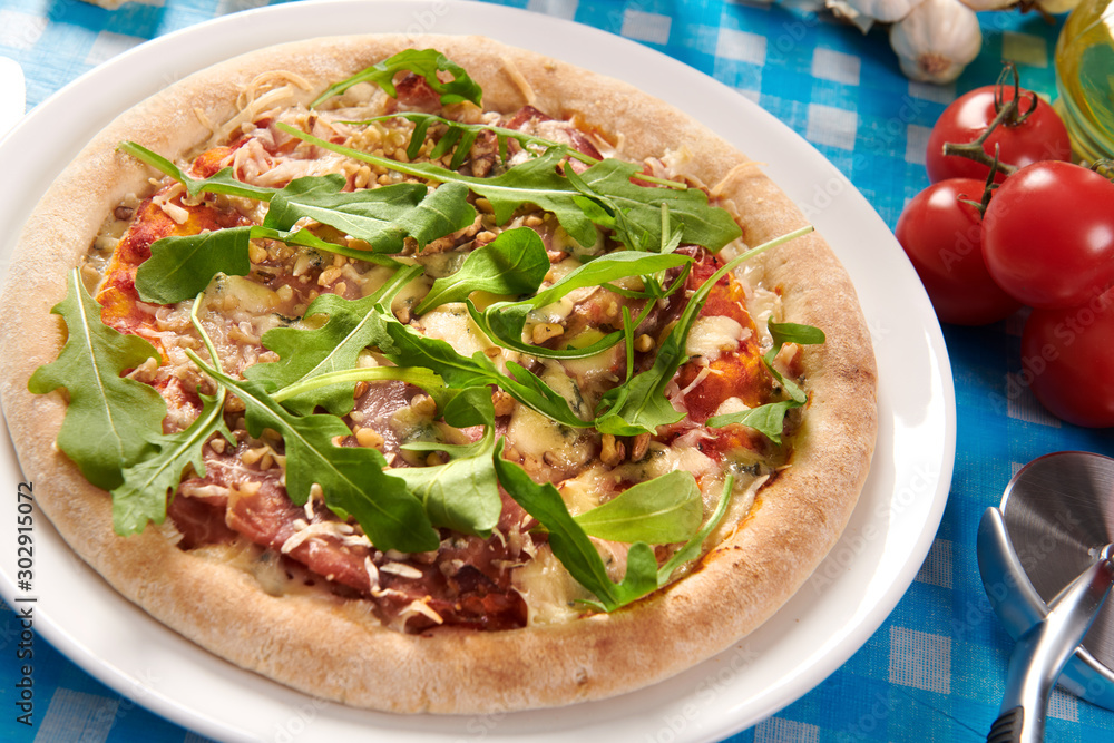 Pizza with prosciutto ham, walnuts, gorgonzola cheese and walnuts Pizza with prosciutto ham, walnuts, gorgonzola cheese and walnuts