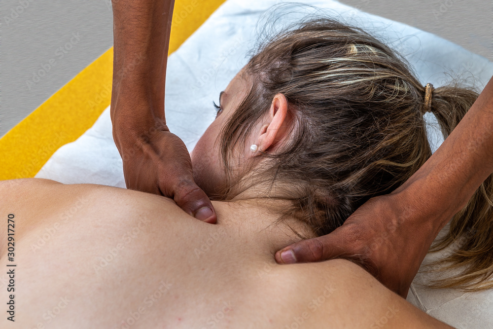Close up of physiotherapist manipulating body part on young woman. Girl laying on madical bed Close up of physiotherapist manipulating body part on young woman. Girl laying on madical bed