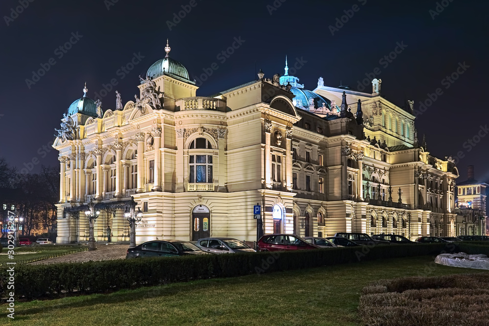 Krakow, Poland. Juliusz Slowacki Theater in night. The theater-opera house was built in 1893 by design of Jan Zawiejski. In 1909, the theater was named after Polish poet Juliusz Slowacki.