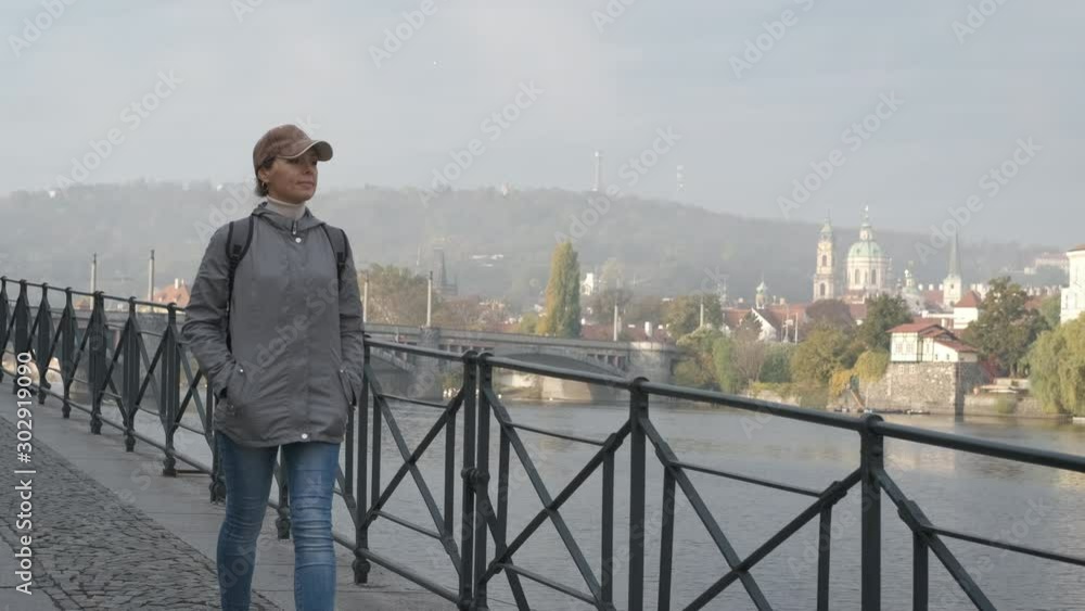 Walk along the promenade. Girl tourist walks along the embankment of the old city. Walk along the promenade. Girl tourist walks along the embankment of the old city.