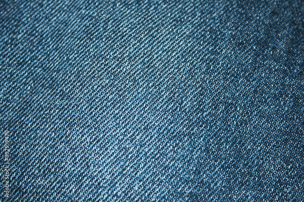 Denim blue jeans texture background. Empty jean fabric. Simple denim cloth canvas close up top view Denim blue jeans texture background. Empty jean fabric. Simple denim cloth canvas close up top view