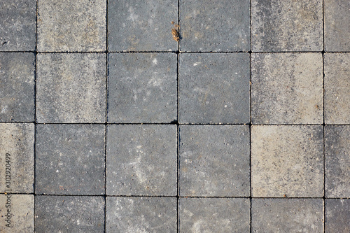 Paving slabs of square brick. Texture of concrete blocks