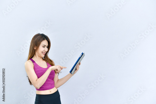 Woman holding exercise pad