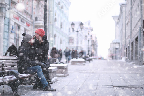 Young couple walking through the winter