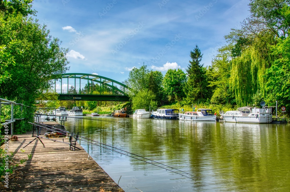 Fototapeta premium bridge over river with fishing lines