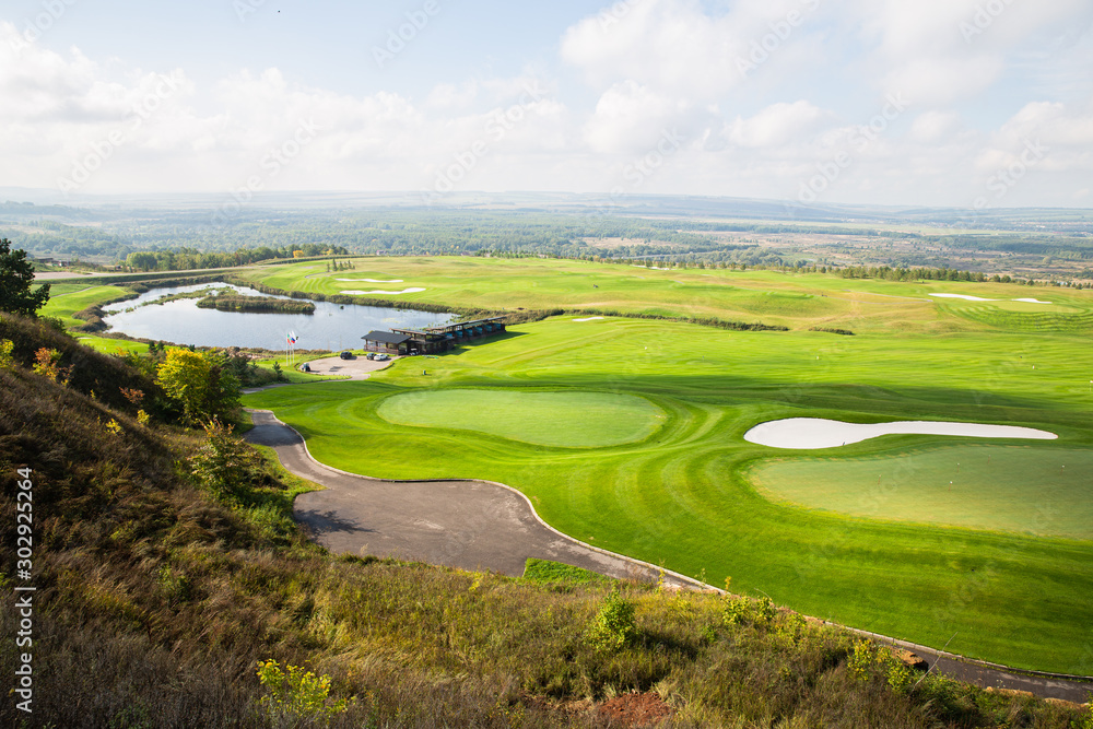 Russian open space. field, forest, sky, road. golf course top view Russian open space. field, forest, sky, road. golf course top view