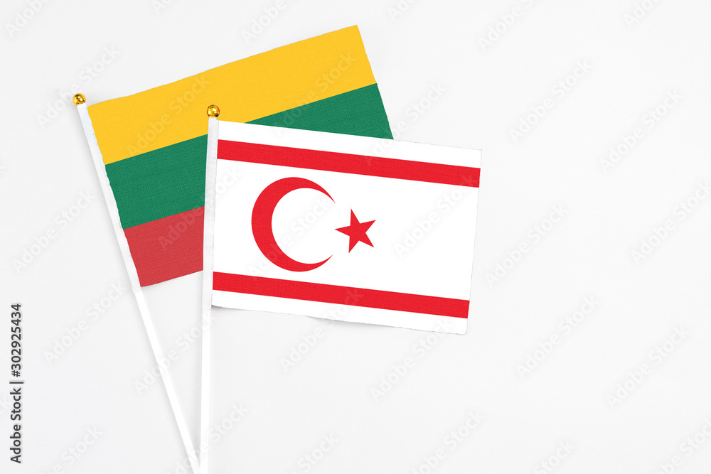 Northern Cyprus and Lithuania stick flags on white background. High quality fabric, miniature national flag. Peaceful global concept.White floor for copy space. Northern Cyprus and Lithuania stick flags on white background. High quality fabric, miniature national flag. Peaceful global concept.White floor for copy space.