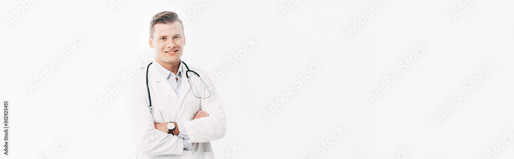 panoramic shot of smiling doctor in white coat standing with crossed arms isolated on white panoramic shot of smiling doctor in white coat standing with crossed arms isolated on white