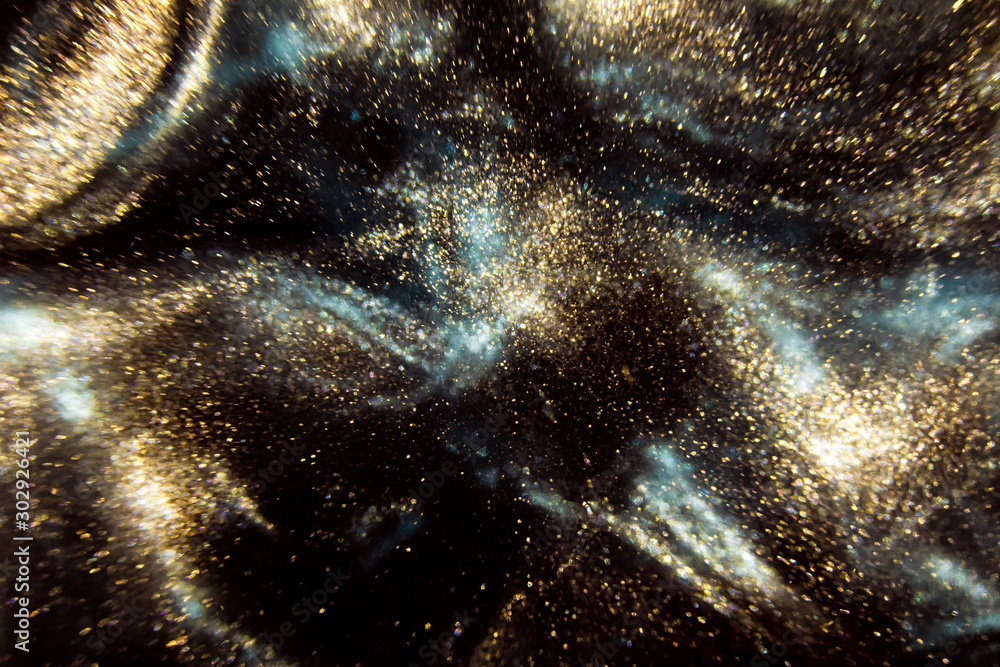 Abstract black and gold festive glitter shimmering water luxury background. de-focused - obrazy, fototapety, plakaty 