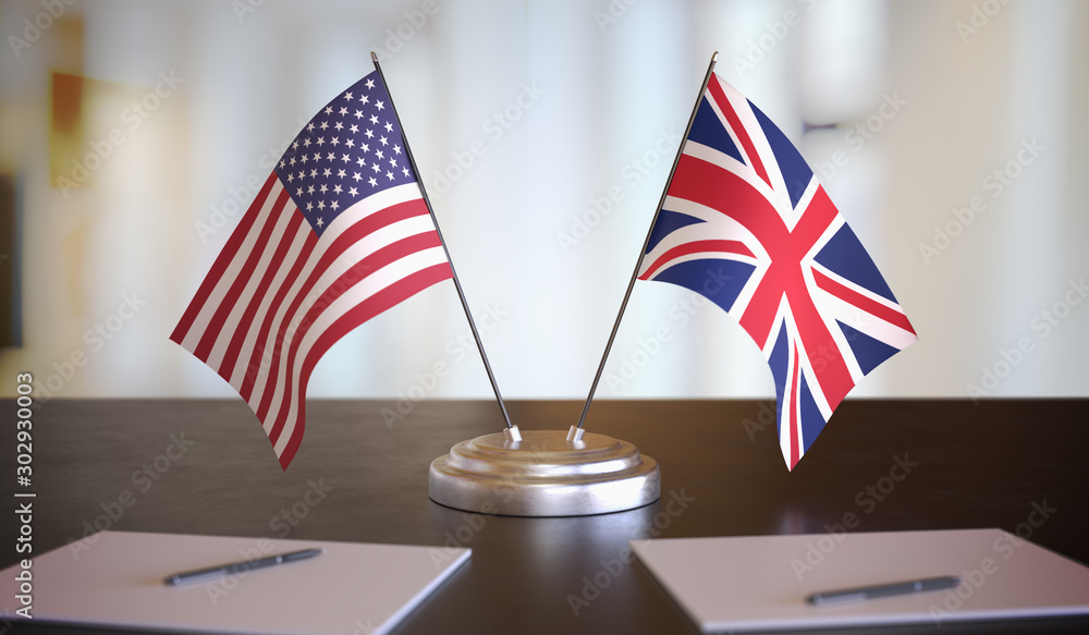 USA and British flags on table. Negotiation between United Kingdom and United states. 3D rendered illustration.