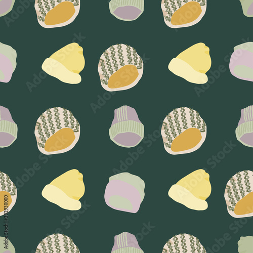 Colourful knitted beanies and hats seamless pattern on dark green background