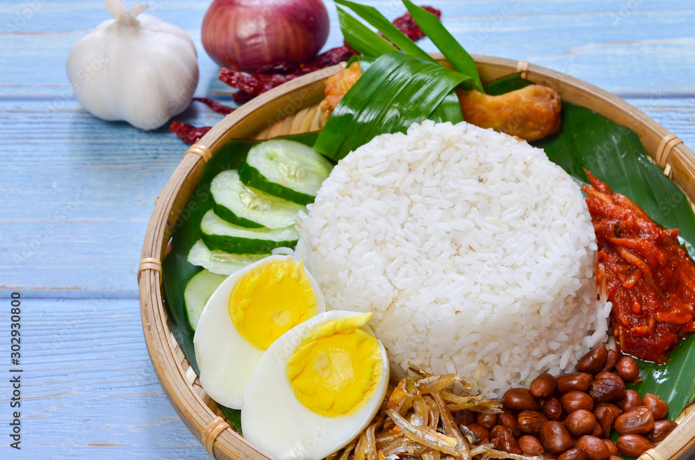 Nasi Lemak is commonly found food in Malaysia, Brunei and Singapore. It is an unofficial national food in Malaysia. Selective focus. Nasi Lemak is commonly found food in Malaysia, Brunei and Singapore. It is an unofficial national food in Malaysia. Selective focus.